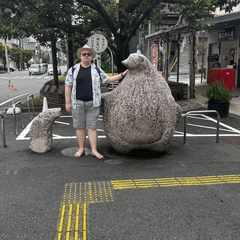 Me posing with a large tanuki statue outside the shōtengai where we stayed.